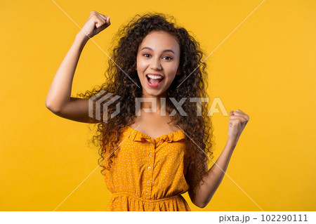 Pretty woman shows triumph yes gesture of victory, she achieved result, goals. Pretty woman shows triumph yes gesture of victory, she achieved result, goals. 102290111