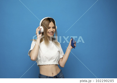 Portrait of her she attractive lovely charming cheery girl listening podcast motivation playlist or relax music. 102290285