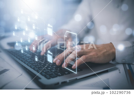 Businessman working on laptop with virtual screen. Online documentation database, IT consultant being set up Virtual Document Management System with laptop,Software for archiving corporate files. 102290736