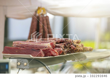 The ribs lie on the counter on top of each other. Meat factory. 102291646