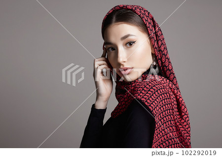 beautiful young woman in color veil and jewelry. beauty girl in colorful hijab beautiful young woman in color veil and jewelry. beauty girl in colorful hijab 102292019