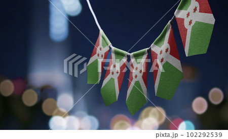 A garland of Burundi national flags on an abstract blurred background A garland of Burundi national flags on an abstract blurred background 102292539