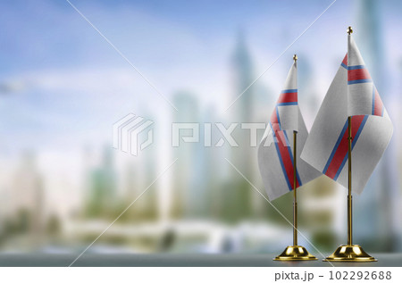 Small flags of the Faroe Islands on an abstract blurry background Small flags of the Faroe Islands on an abstract blurry background 102292688