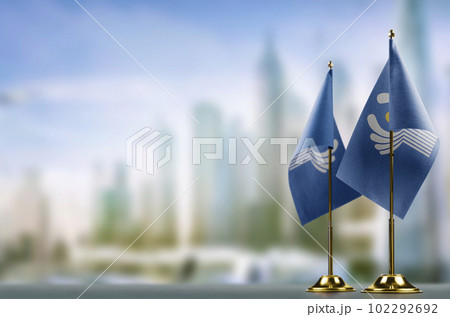 Small flags of the CIS on an abstract blurry background Small flags of the CIS on an abstract blurry background 102292692