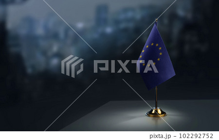Small national flag of the European Union on a black background 102292752