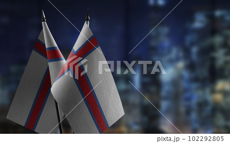 Small flags of the Faroe Islands on an abstract blurry background 102292805