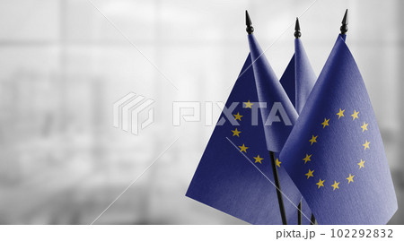 Small national flag of the European Union on a black background 102292832