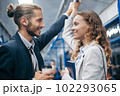 man and woman in love looking at each other on a subway train. 102293065
