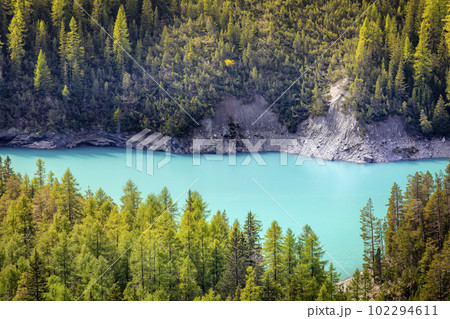 Turquoise alpine lake in Swiss national park, Switzerland 102294611