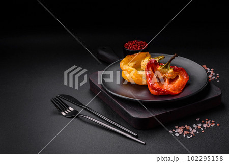 Delicious juicy grilled peppers with spices and herbs Delicious juicy grilled peppers with spices and herbs 102295158