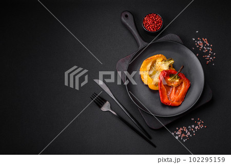 Delicious juicy grilled peppers with spices and herbs 102295159