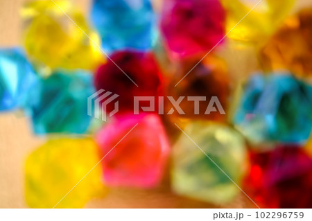 Multicolored crystal jewel background. Bright artificial gems. 102296759