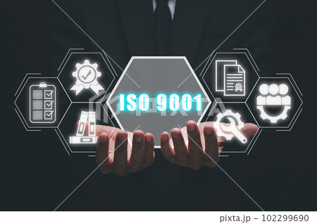 ISO 9001 concept, Businessman hand holding iso 9001 icon on virtual screen. 102299690