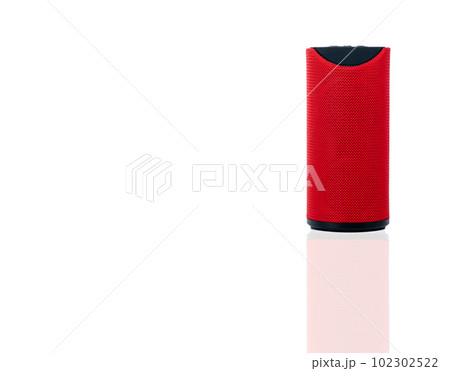 Wireless portable speaker isolated on white background. Red Digital portable speakers. Small sound music box speaker. Modern design mini portable Wireless loudspeaker. Digital wireless technology. 102302522