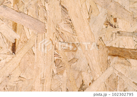 The texture of the OSB plate. Close-up. 102302795