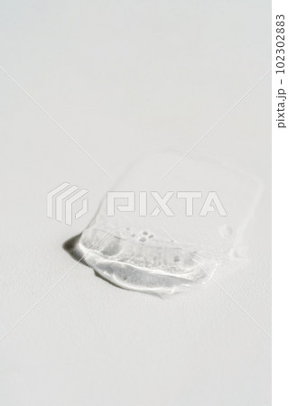 Transparent cosmetic gel on the white background. Transparent cosmetic gel on the white background. 102302883
