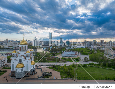 Summer Yekaterinburg and Temple on Blood in cloudy sunset. Aerial view of Yekaterinburg, Russia. Translation of the text on the temple Summer Yekaterinburg and Temple on Blood in cloudy sunset. Aerial view of Yekaterinburg, Russia. Translation of the text on the temple 102303627