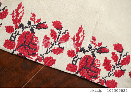 Line striped closeup weave fabric for kitchen towel material. Pinstripe fiber picnic table cloth . Black and red embroidery. Embroidered good like old handmade cross-stitch ethnic Ukraine pattern. Line striped closeup weave fabric for kitchen towel material. Pinstripe fiber picnic table cloth . Black and red embroidery. Embroidered good like old handmade cross-stitch ethnic Ukraine pattern. 102306622