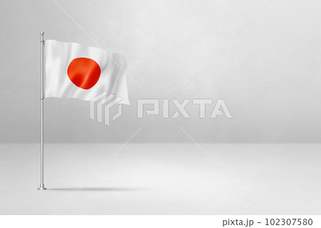 Japanese flag isolated on white concrete wall background Japanese flag isolated on white concrete wall background 102307580