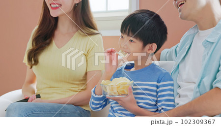 asian boy eat unhealthy food 102309367