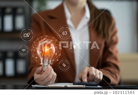 Female businessman thinking ideas strategy working concept at the desk in the office. Female businessman thinking ideas strategy working concept at the desk in the office. 102311583