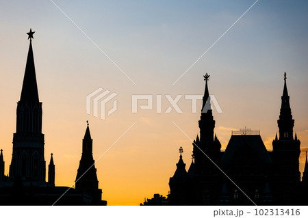 Silhouettes of towers near Moscow Kremlin on sunset 102313416