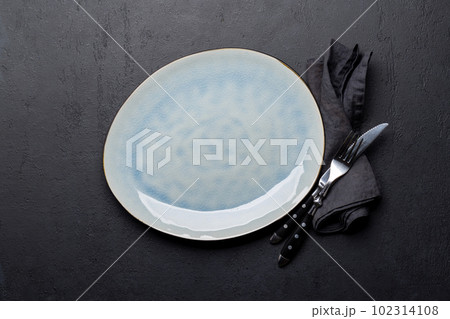 Empty plate with fork and knife Empty plate with fork and knife 102314108