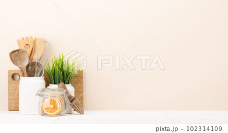 Kitchen utensils on wooden table Kitchen utensils on wooden table 102314109