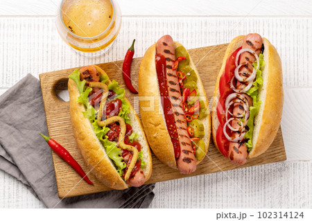 Various hot dog and beer 102314124