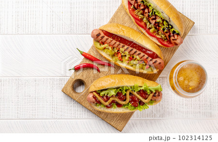 Various hot dog and beer 102314125