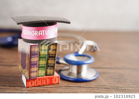 Graduation hat on book with copy space, learning university education concept. Graduation hat on book with copy space, learning university education concept. 102318925