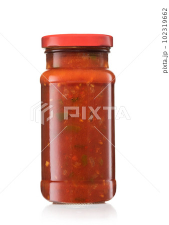 Glass jar with taco nachos salsa hot dip sauce on white. Glass jar with taco nachos salsa hot dip sauce on white. 102319662