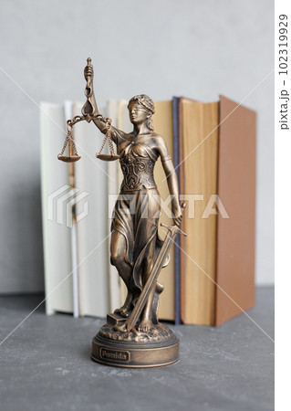 themis goddess of justice statuette, symbol of law with scales and sword in his hands themis goddess of justice statuette, symbol of law with scales and sword in his hands 102319929