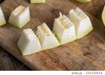 Ripe sweet melon pulp divided into small pieces Ripe sweet melon pulp divided into small pieces 102320616