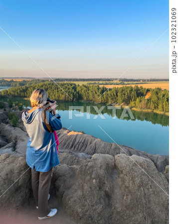 tourist girl hold in hands take photography click on modern photo camera tourist girl hold in hands take photography click on modern photo camera 102321069