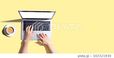 Person using a laptop computer Person using a laptop computer 102321930