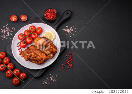 Delicious fried sea bass fish in the form of slices with spices and herbs Delicious fried sea bass fish in the form of slices with spices and herbs 102322032