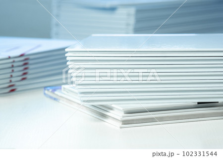 stack of photo books close-up, partial blur stack of photo books close-up, partial blur 102331544