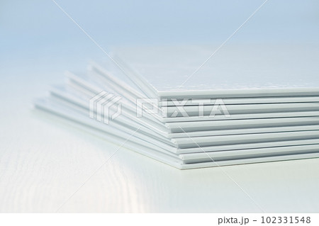 stack of printed products, close-up photo books, blank covers 102331548