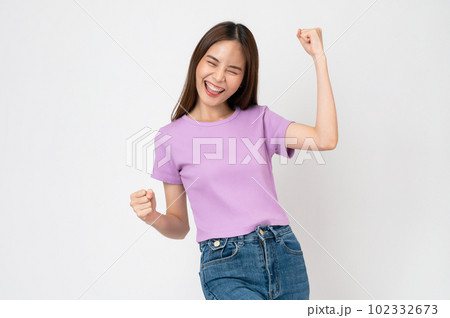 woman fists clenched with shows strong powerful, celebrating victory expressing success. 102332673