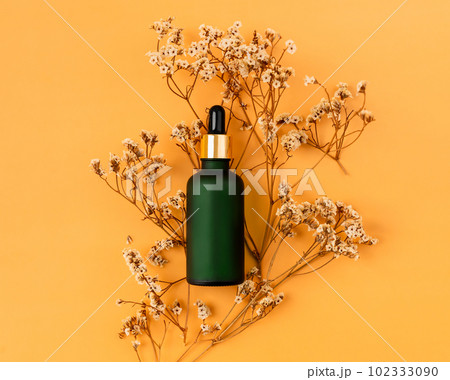 Top view of cosmetic bottle cream mockup, Blank label package on orange background. 102333090