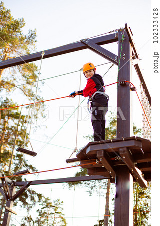 Active children's recreation. Climbing the rope park 102333428