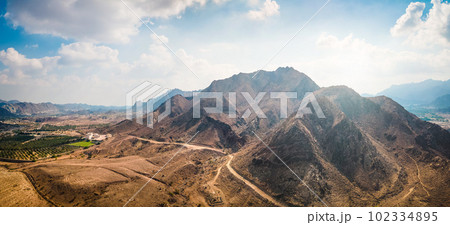 Hatta city sign in Hajar mountains in Hatta enclave of Dubai in the UAE Hatta city sign in Hajar mountains in Hatta enclave of Dubai in the UAE 102334895