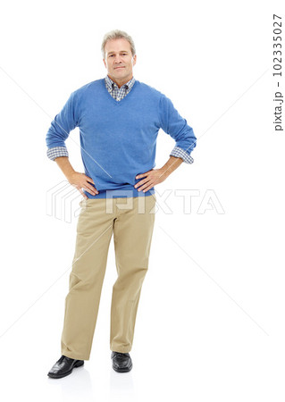 Secure in who he is. Full length studio shot of a mature, attractive male in a casual stance with his hands on his hips. Secure in who he is. Full length studio shot of a mature, attractive male in a casual stance with his hands on his hips. 102335027
