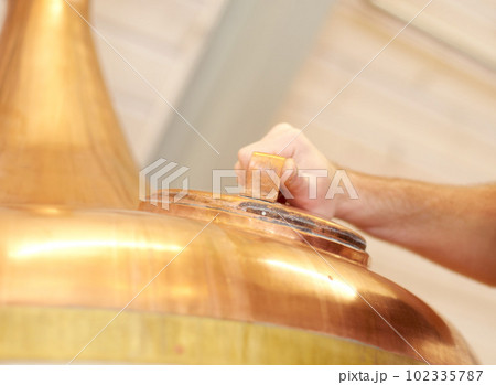 Brewery, copper tun and tank for beer, alcohol or brewing process with hatch. Man, hand and alcohol industry or distillery for storage, fermentation and manufacturing system with industrial equipment Brewery, copper tun and tank for beer, alcohol or brewing process with hatch. Man, hand and alcohol industry or distillery for storage, fermentation and manufacturing system with industrial equipment 102335787