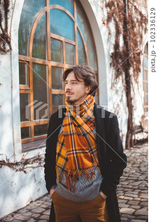 man walking around Prague, beautiful portrait, stylish traveler. man walking around Prague, beautiful portrait, stylish traveler. 102336129