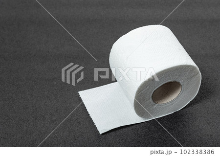 White soft hygienic paper. Roll of toilet paper on gray background. Restroom soft touch toilet paper 102338386