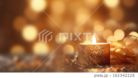 one burning candle lights at the edge of blurred festive background, decorative golden shiny candle lights copy space, Holiday,Happy New Year,Merry Christmas,Festive,party background concept 102342228