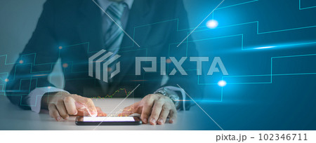 Business analyzing company financial balance sheet working with digital virtual graphics financial investment growth goals touch screen smartphone technology 102346711