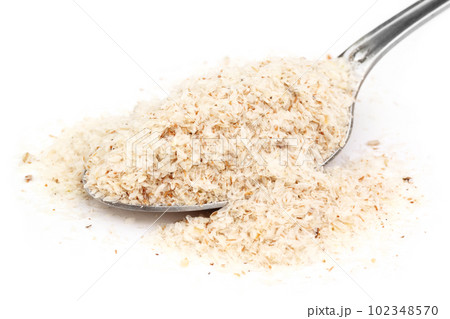 Medicinal herbs isabgul on a spoon 102348570